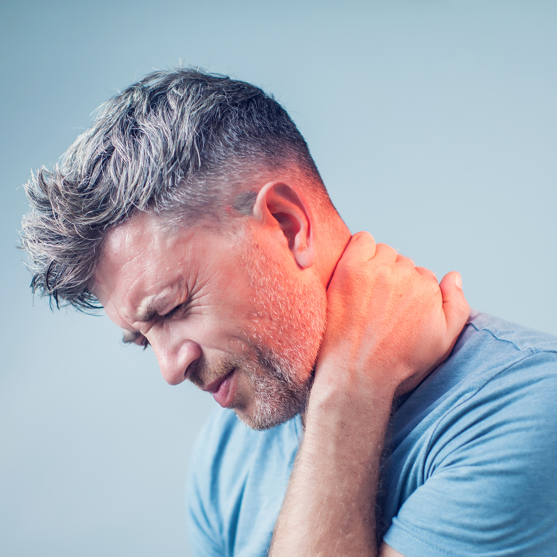 Young man suffering from neck pain